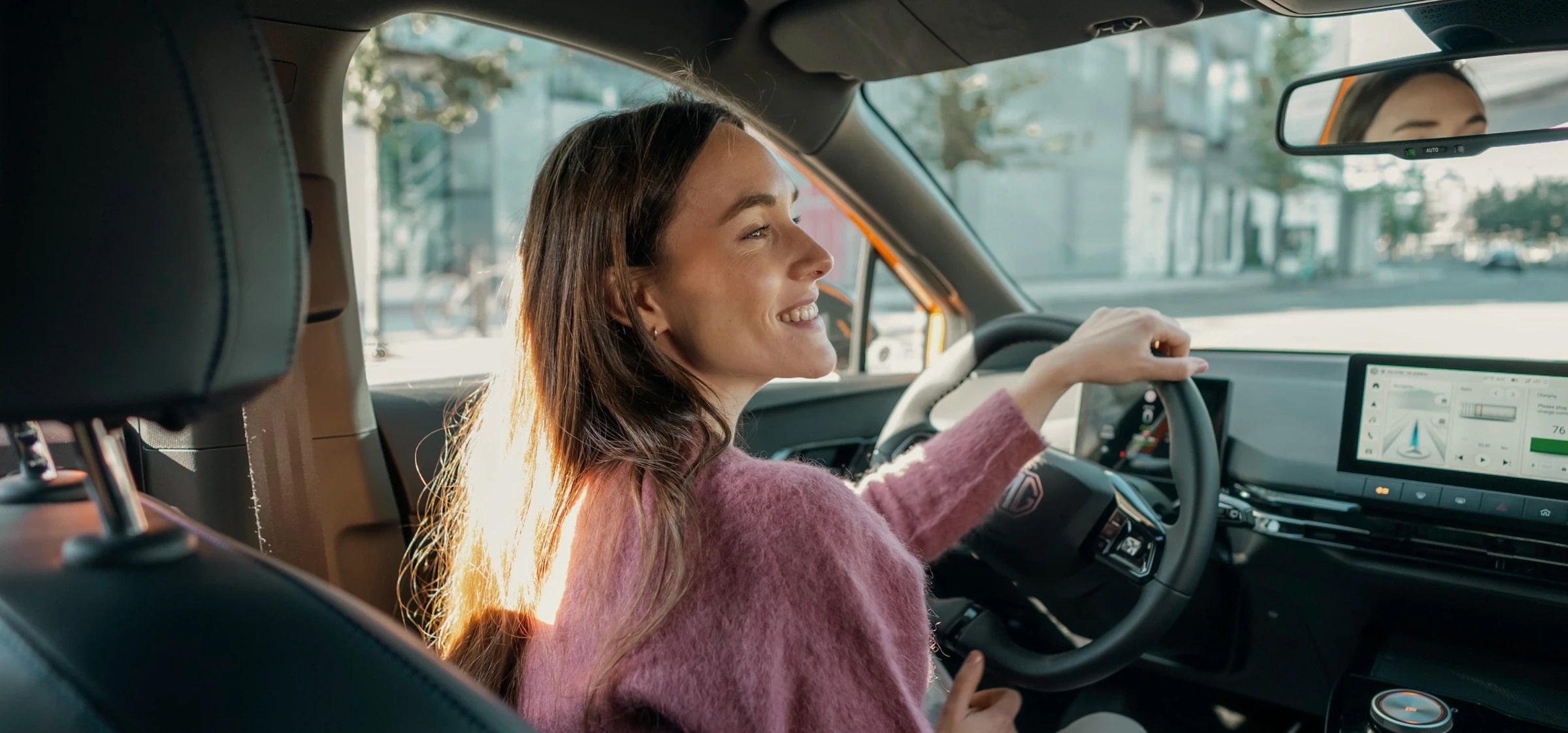 Image of a woman driving an MG 4 EV