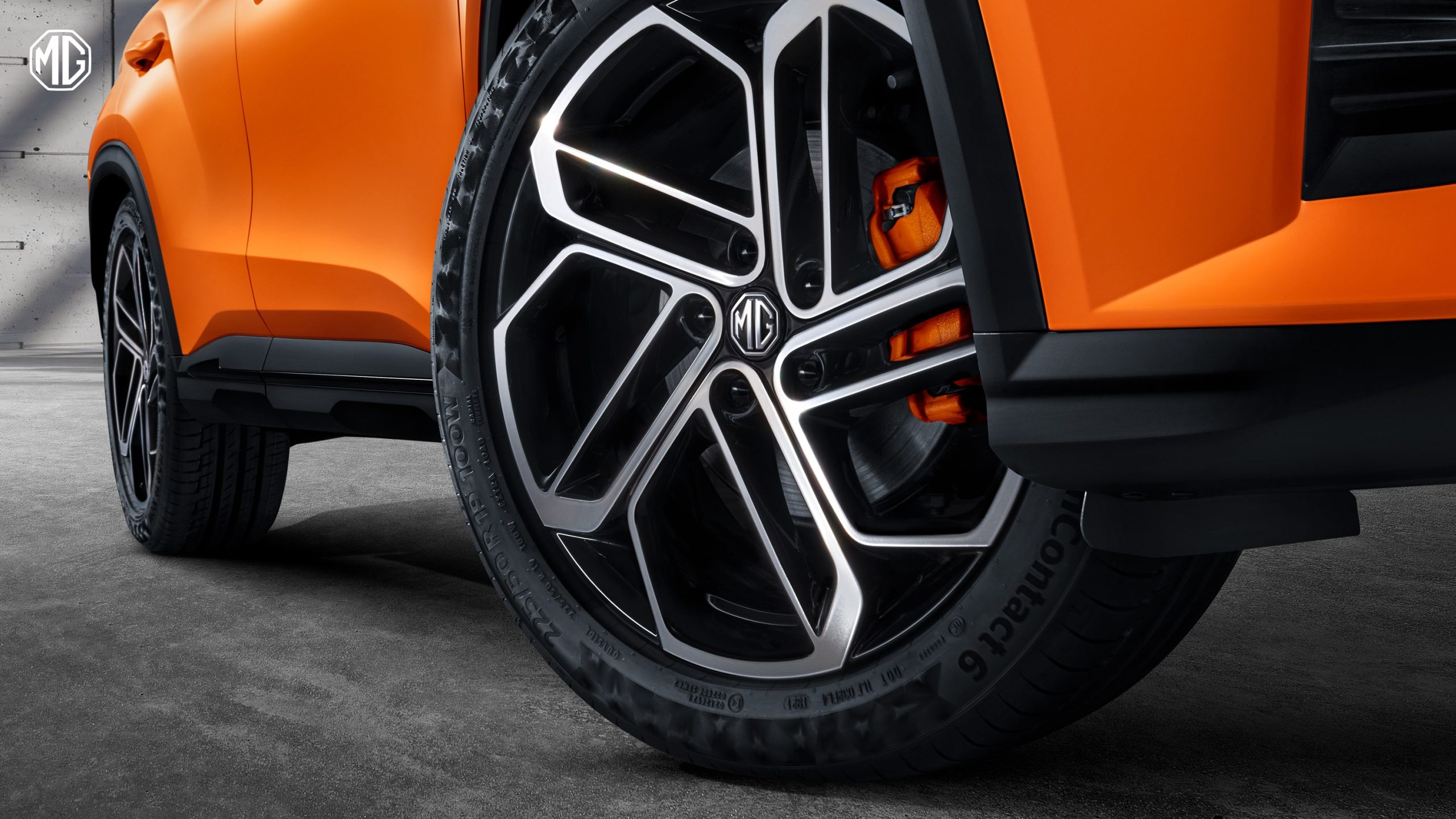 Image of closeup of rear wheel of an orange MG One