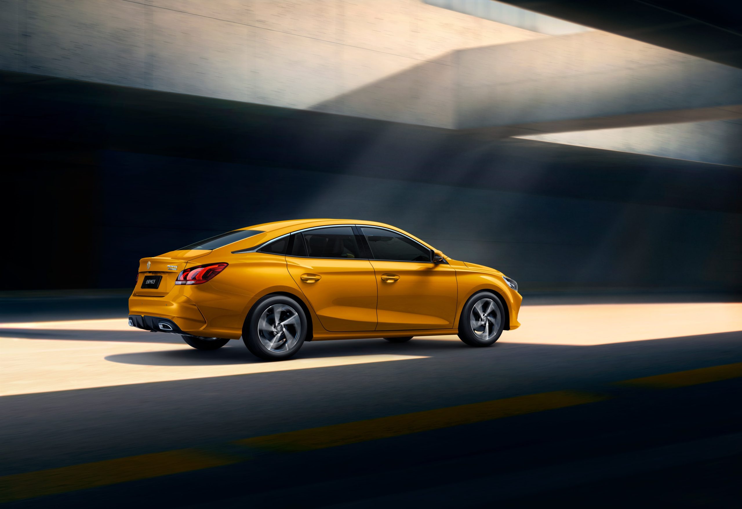 Image of yellow MG GT on the road