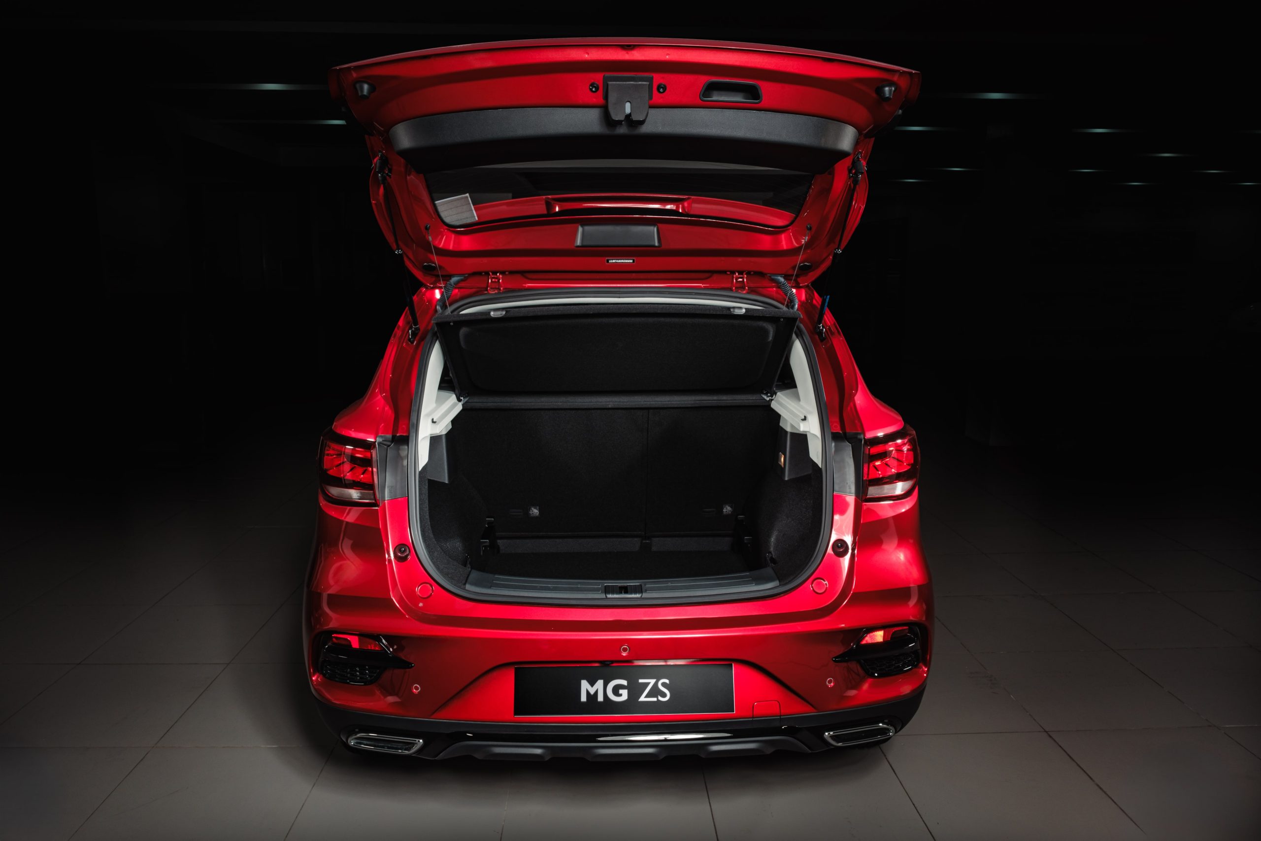 Image of open trunk of a red MG ZS.