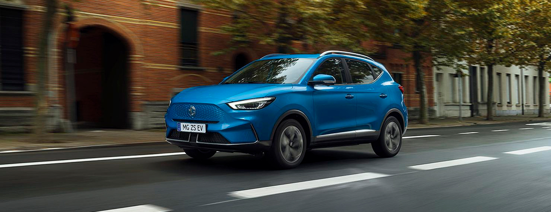 Image of MG ZS EV driving on a city road.