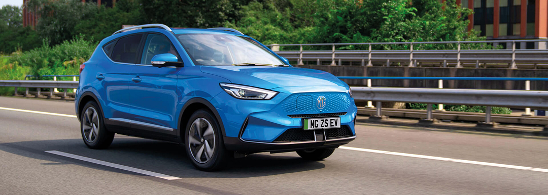 Image of blue MG ZS EV on the road.