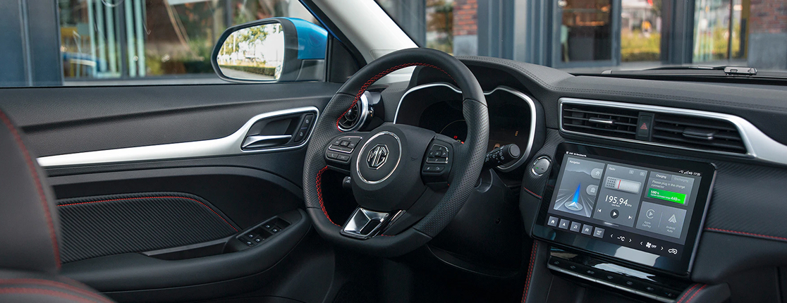Image of the leather multifunctional steering wheel and dashboard of the MG ZS EV.