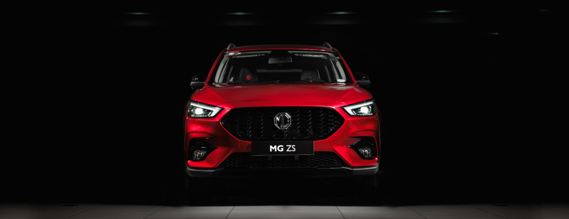 Image of front view of a red MG ZS.