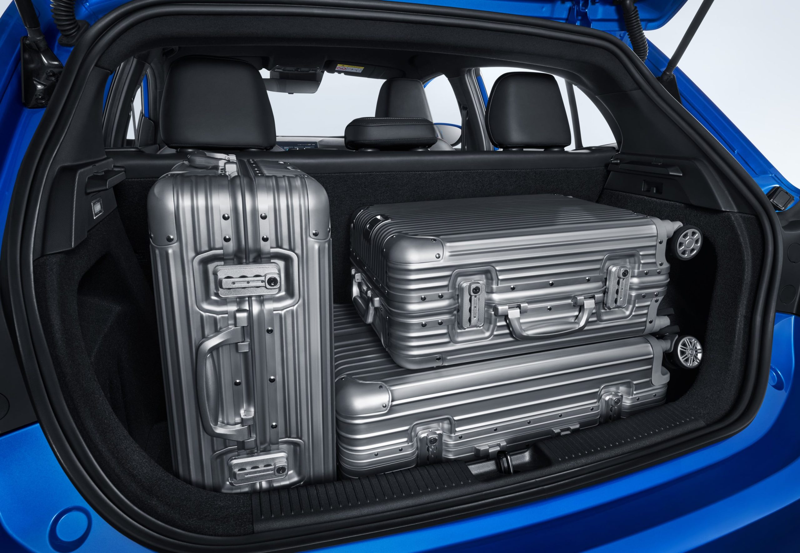 Image of MG 3's 241L trunk with three large suitcases.