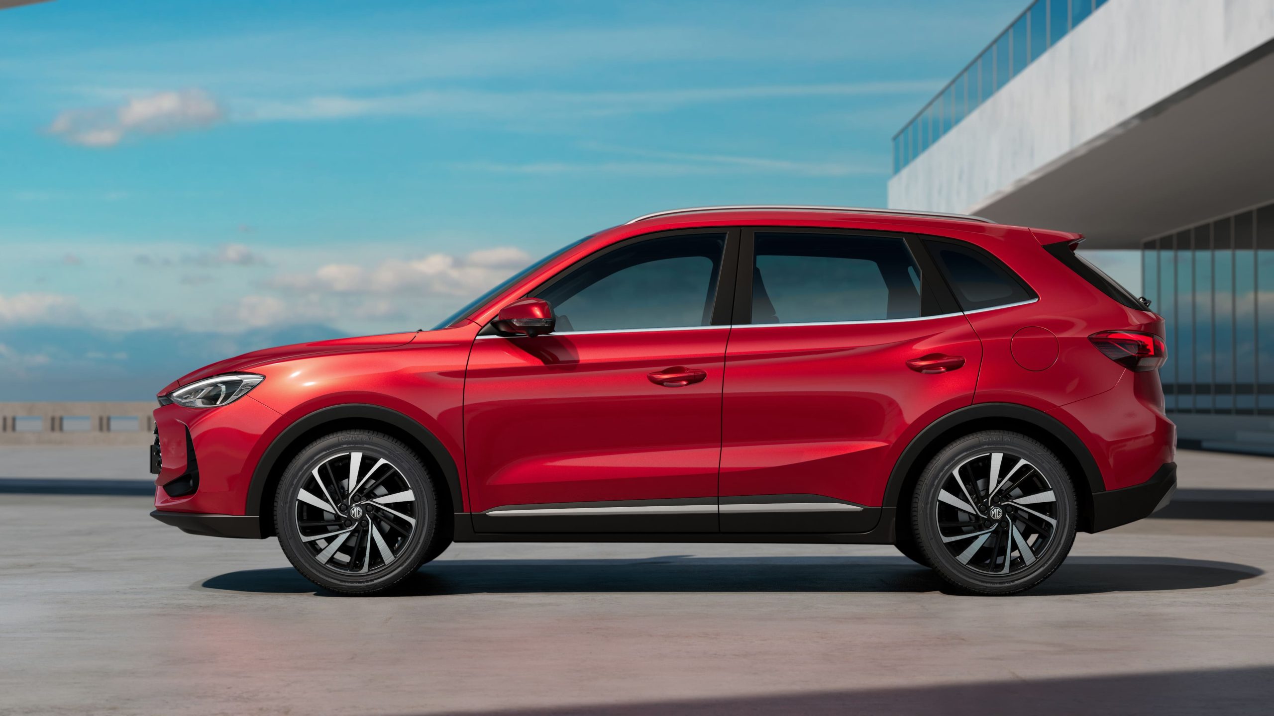 Side view of a red MG ZS